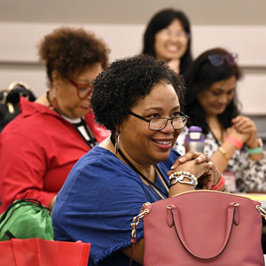 Women sitting in the audience at the conference