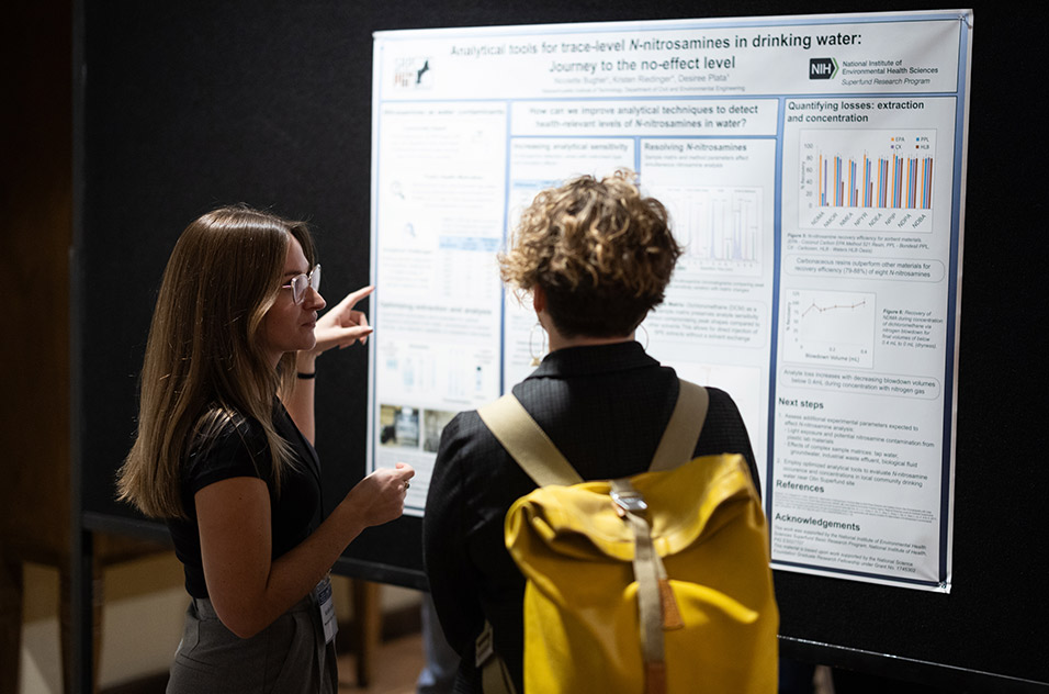 Nicolette Bugher, left, of the Massachusetts Institute of Technology SRP Center, explained a new technique to characterize N-Nitrosamines in drinking water. (Photo courtesy of William Bledsoe)